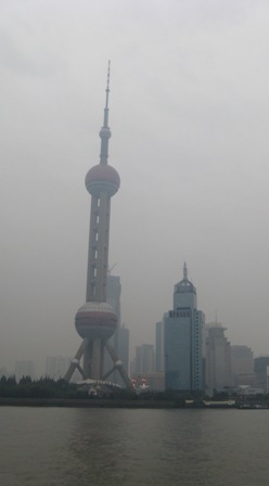 Pudong's telecommunications tower opposite Shanghai city.