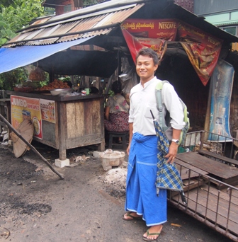Grasshopper Adventure tours 'Tea House' tour guide Lu Wine outside Mandalay's best tempura stall.